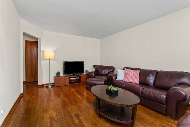 5128 Suffield Ct, Skokie, IL 60077 - living area featuring dark wood-style flooring and baseboards