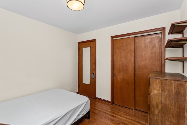 5128 Suffield Ct, Skokie, IL 60077 - bedroom featuring wood finished floors and a closet