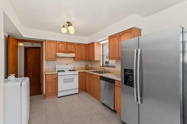 5128 Suffield Ct, Skokie, IL 60077 - kitchen with stainless steel appliances, under cabinet range hood, light countertops, and light tile patterned floors