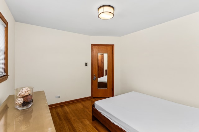 5128 Suffield Ct, Skokie, IL 60077 - bedroom featuring dark wood-type flooring and baseboards