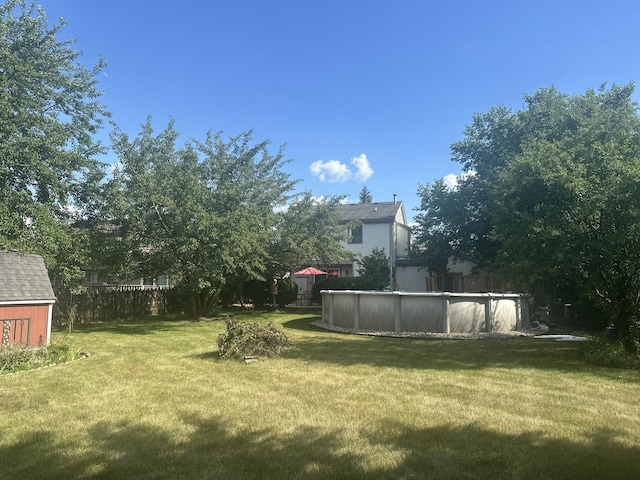 724 Cimarron Dr, Cary, IL 60013 - fenced backyard with an outdoor pool and a storage shed