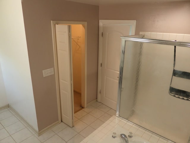 1010 Trillium Ln, Bartlett, IL 60103 - full bath featuring a shower stall, a spacious closet, and tile patterned flooring