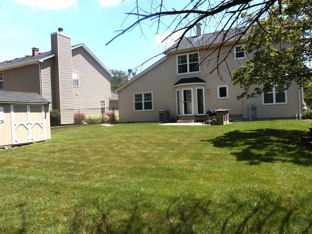 1010 Trillium Ln, Bartlett, IL 60103 - back of house with a storage shed and entry steps