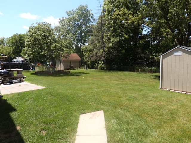 1010 Trillium Ln, Bartlett, IL 60103 - view of yard with a storage unit and a patio