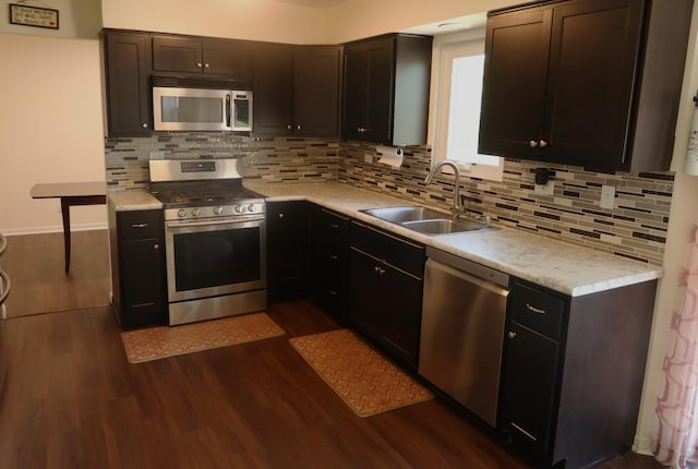 1010 Trillium Ln, Bartlett, IL 60103 - kitchen featuring stainless steel appliances, dark wood-type flooring, light countertops, and tasteful backsplash