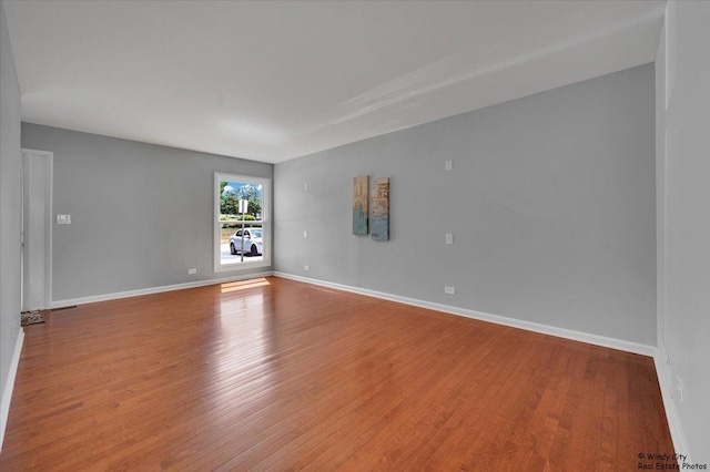 1718 Ardwick Dr, Hoffman Estates, IL 60169 - spare room featuring wood finished floors and baseboards