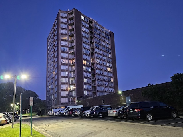 3925 Triumvera Dr Unit A15D, Glenview, IL 60025 - property at night with a view of apartment building / complex and uncovered parking
