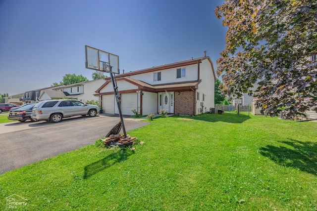 2123 Mallard Ln, Hanover Park, IL 60133 - view of front of home featuring asphalt driveway, brick siding, and a garage