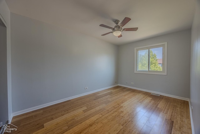 2123 Mallard Ln, Hanover Park, IL 60133 - empty room with a ceiling fan and light wood-style floors
