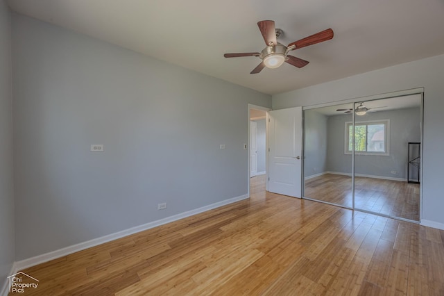 2123 Mallard Ln, Hanover Park, IL 60133 - unfurnished bedroom featuring light wood-type flooring, a closet, and a ceiling fan