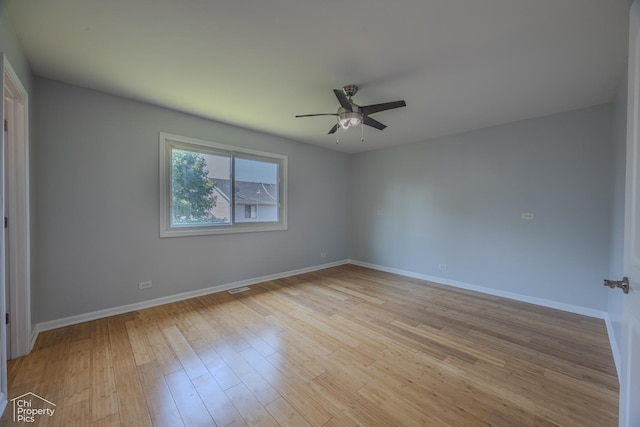 2123 Mallard Ln, Hanover Park, IL 60133 - spare room featuring a ceiling fan and light wood-type flooring