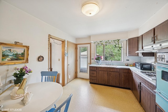 2555 Stratford Ave, Westchester, IL 60154 - kitchen featuring light countertops, gas stovetop, decorative backsplash, a warming drawer, and light floors