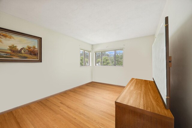 2555 Stratford Ave, Westchester, IL 60154 - unfurnished room with wood finished floors and baseboards