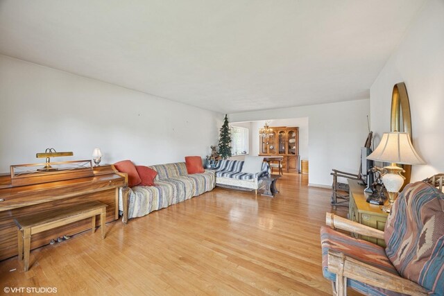 2555 Stratford Ave, Westchester, IL 60154 - living room with light wood-style flooring and a chandelier