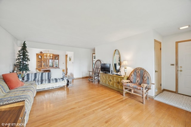 2555 Stratford Ave, Westchester, IL 60154 - living area with wood finished floors and a chandelier