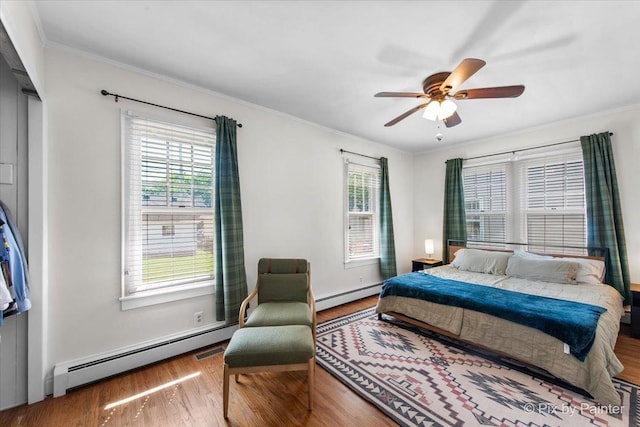 1020 S 4th St, Saint Charles, IL 60174 - bedroom featuring a baseboard radiator, wood finished floors, ornamental molding, and a ceiling fan