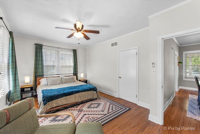 1020 S 4th St, Saint Charles, IL 60174 - bedroom with wood finished floors, crown molding, and ceiling fan