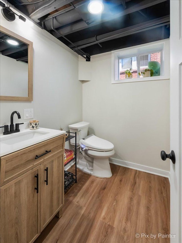 1020 S 4th St, Saint Charles, IL 60174 - half bath featuring vanity and wood finished floors