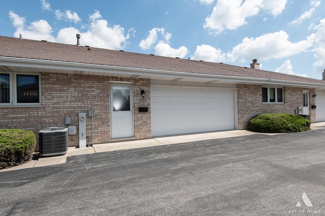 11015 New Mexico Ct, Orland Park, IL 60467 - view of front facade with brick siding, a chimney, and a garage