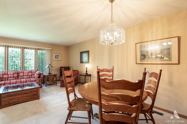 11015 New Mexico Ct, Orland Park, IL 60467 - dining area featuring light colored carpet and a chandelier