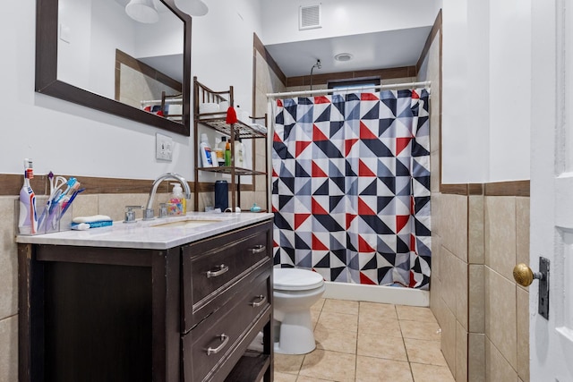 844 Haskell Ave, Rockford, IL 61103 - bathroom with tile walls, vanity, curtained shower, tile patterned floors, and wainscoting