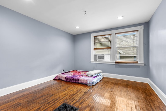 844 Haskell Ave, Rockford, IL 61103 - bedroom with cooling unit, wood finished floors, and recessed lighting