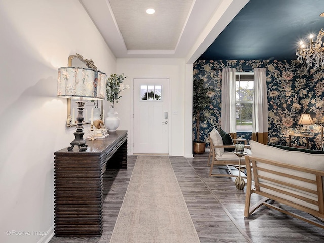257 Kennedy Dr, Saint Charles, IL 60175 - foyer entrance with wallpapered walls, wood finished floors, and a chandelier