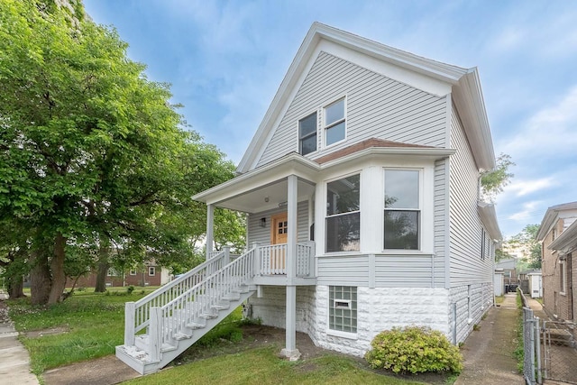 8007 S Avalon Ave, Chicago, IL 60619 - view of front of house with stairway and a porch