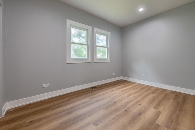 8007 S Avalon Ave, Chicago, IL 60619 - empty room featuring light wood-style floors and recessed lighting
