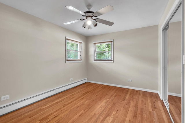 7952 Madison St Unit 2E, River Forest, IL 60305 - empty room with baseboard heating, light wood-style flooring, and a ceiling fan