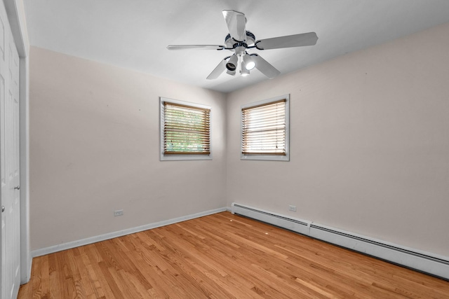 7952 Madison St Unit 2E, River Forest, IL 60305 - empty room featuring baseboard heating, light wood-type flooring, and ceiling fan