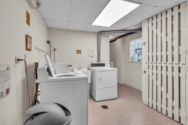 7952 Madison St Unit 2E, River Forest, IL 60305 - shared laundry featuring washing machine and clothes dryer and light tile patterned floors