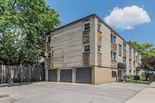 7952 Madison St Unit 2E, River Forest, IL 60305 - view of building exterior with a garage