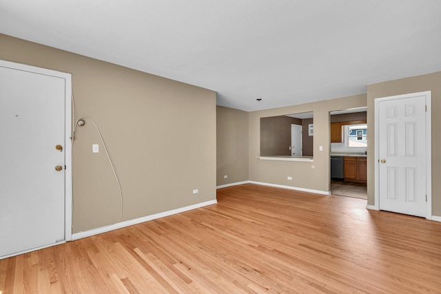 7952 Madison St Unit 2E, River Forest, IL 60305 - unfurnished living room with light wood-type flooring and baseboards