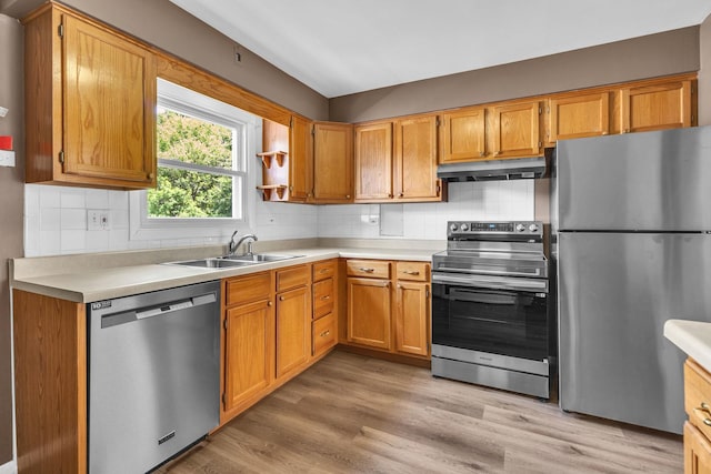 7952 Madison St Unit 2E, River Forest, IL 60305 - kitchen featuring stainless steel appliances, under cabinet range hood, light countertops, and decorative backsplash
