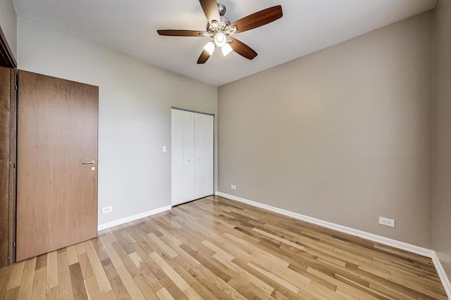 3109 W Argyle St Unit 3, Chicago, IL 60625 - unfurnished bedroom with light wood-type flooring, a ceiling fan, and a closet