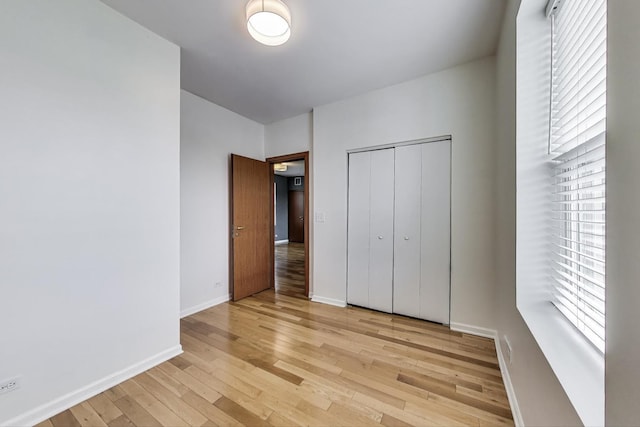 3109 W Argyle St Unit 3, Chicago, IL 60625 - unfurnished bedroom with light wood finished floors and a closet