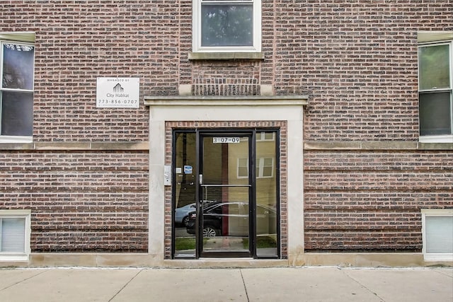 3109 W Argyle St Unit 3, Chicago, IL 60625 - doorway to property featuring brick siding