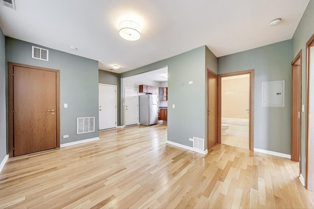 3109 W Argyle St Unit 3, Chicago, IL 60625 - unfurnished living room featuring electric panel and light wood-style flooring