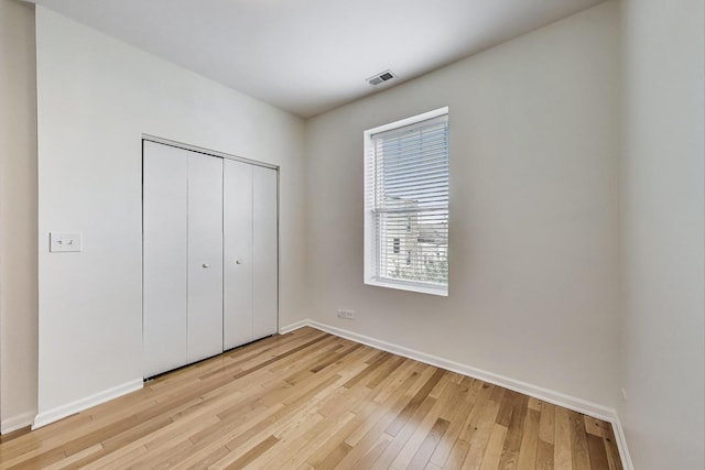 3109 W Argyle St Unit 3, Chicago, IL 60625 - unfurnished bedroom with light wood-style floors and a closet