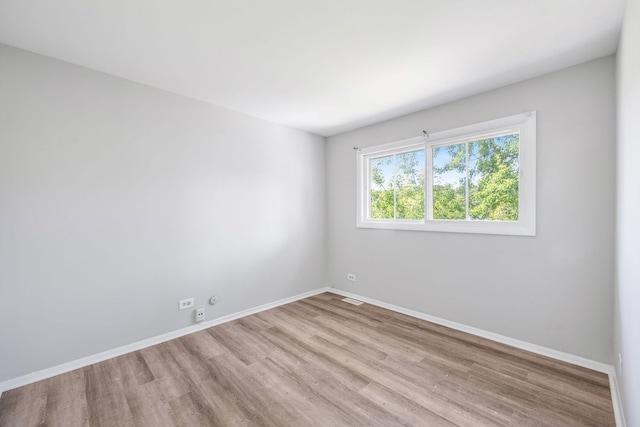 3075 Kingston Ct, Streamwood, IL 60107 - unfurnished room featuring wood finished floors and baseboards