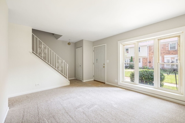 3075 Kingston Ct, Streamwood, IL 60107 - carpeted foyer entrance featuring baseboards and stairway