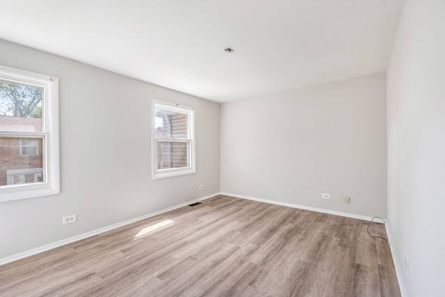 3075 Kingston Ct, Streamwood, IL 60107 - unfurnished room with plenty of natural light and light wood-style flooring