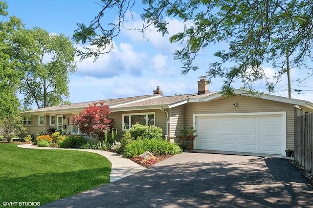 3245 Greenbriar Dr, Glenview, IL 60025 - ranch-style home featuring asphalt driveway, an attached garage, and a chimney