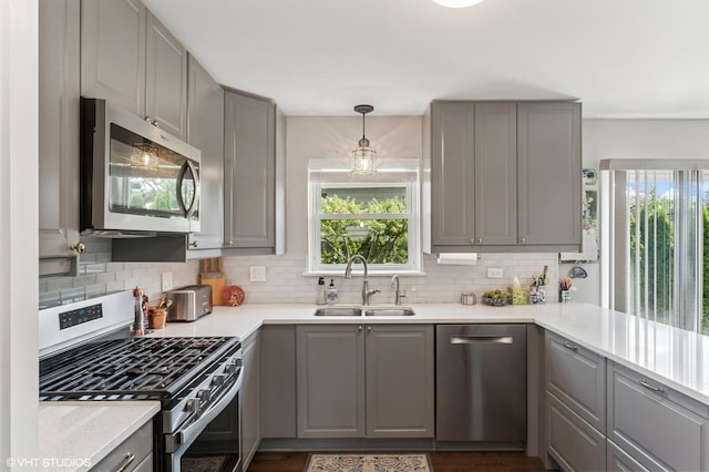 3245 Greenbriar Dr, Glenview, IL 60025 - kitchen with appliances with stainless steel finishes, gray cabinetry, and healthy amount of natural light