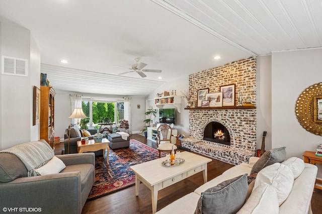 3245 Greenbriar Dr, Glenview, IL 60025 - living room with vaulted ceiling, dark wood finished floors, ceiling fan, a brick fireplace, and recessed lighting