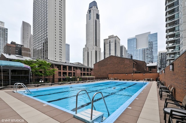 1030 N State St Unit 21K, Chicago, IL 60610 - community pool featuring a view of skyline