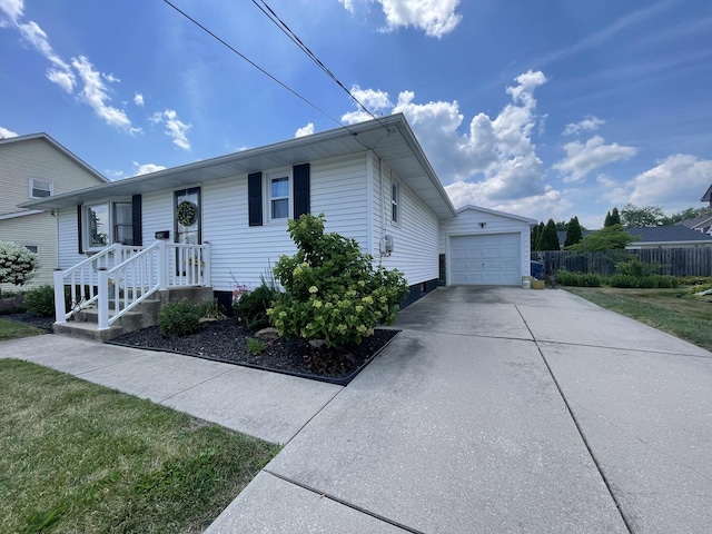 1110 Pike St, Peru, IL 61354 - single story home featuring concrete driveway, an outdoor structure, and a detached garage