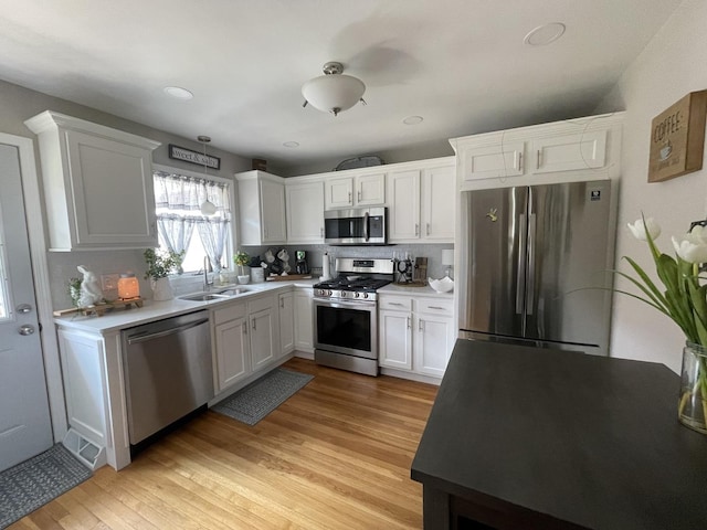 1110 Pike St, Peru, IL 61354 - kitchen featuring appliances with stainless steel finishes, white cabinetry, and backsplash