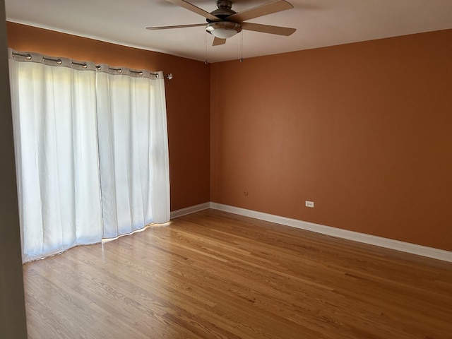 9842 S 88th Ave, Palos Hills, IL 60465 - unfurnished room featuring ceiling fan and wood finished floors